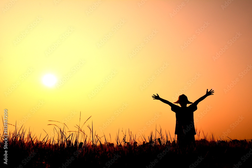 Silhouette children open hand at sunset Silhouette children open hand at sunset