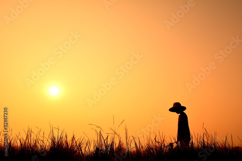 Silhouette children farmer at sunrise