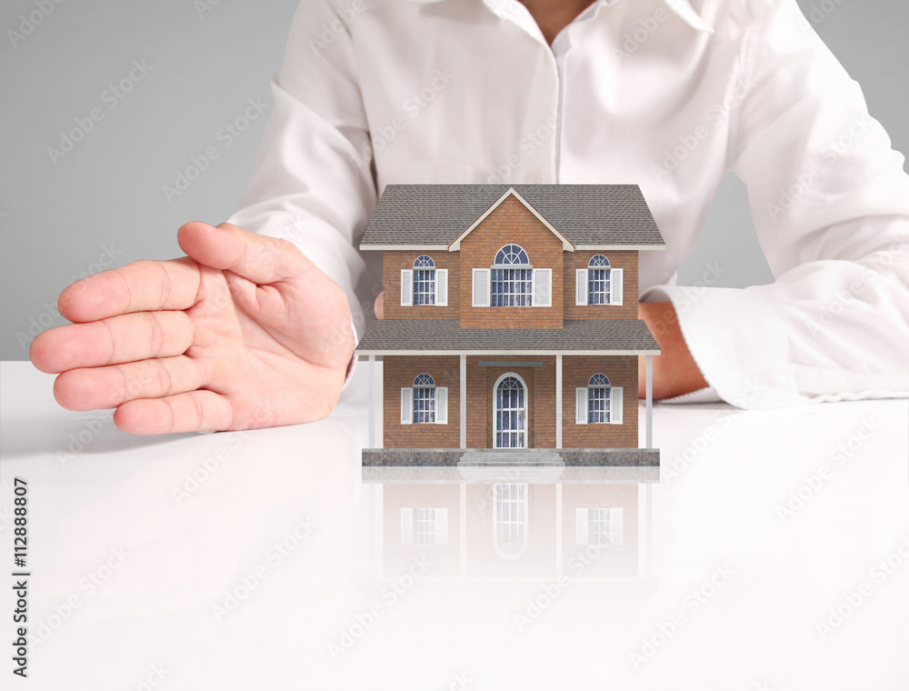 Mortgage concept by house from hand Mortgage concept by house from hand