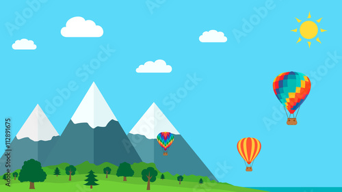 Balloons on a background of mountains. Blue sky.