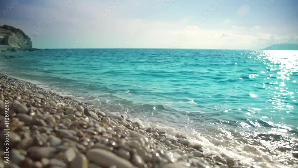 Ocean, peeble shore and waves. Seascape at sunset or sunrise. Ocean, peeble shore and waves. Seascape at sunset or sunrise.