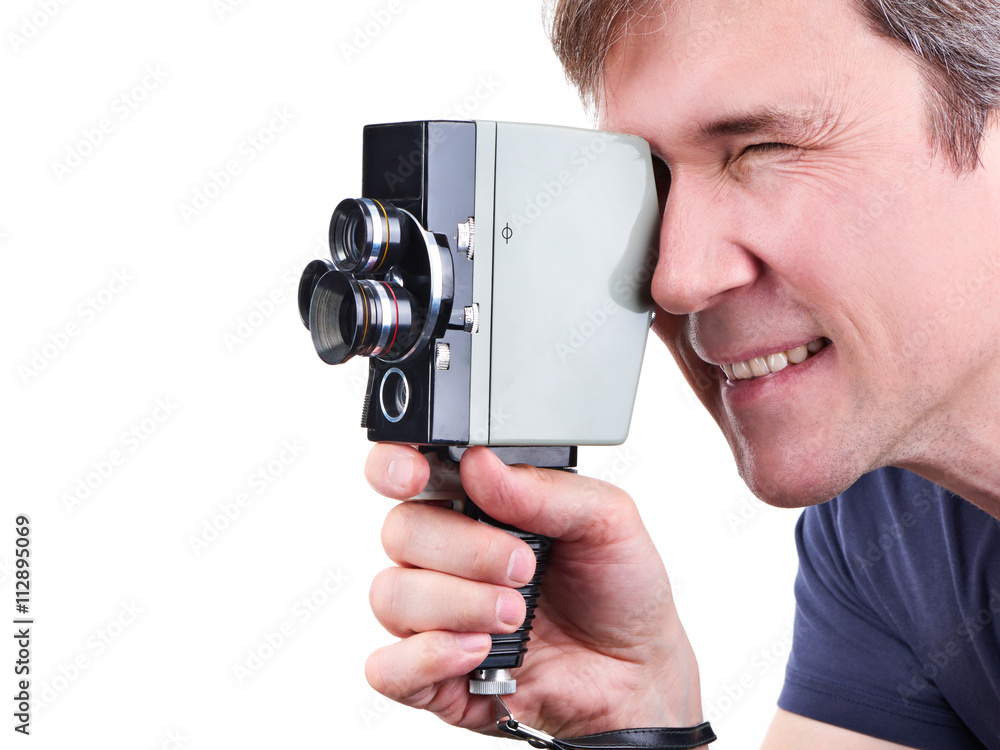 Fototapeta premium Retro movie camera in hands of operator isolated