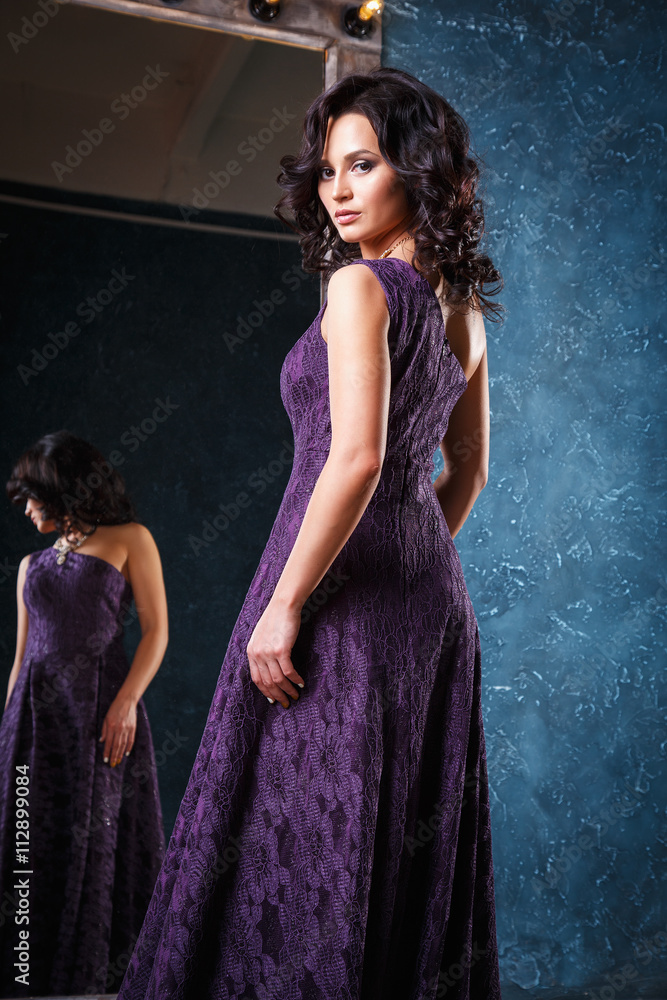 Obraz premium portrait of beautiful elegant young woman in gorgeous evening dress