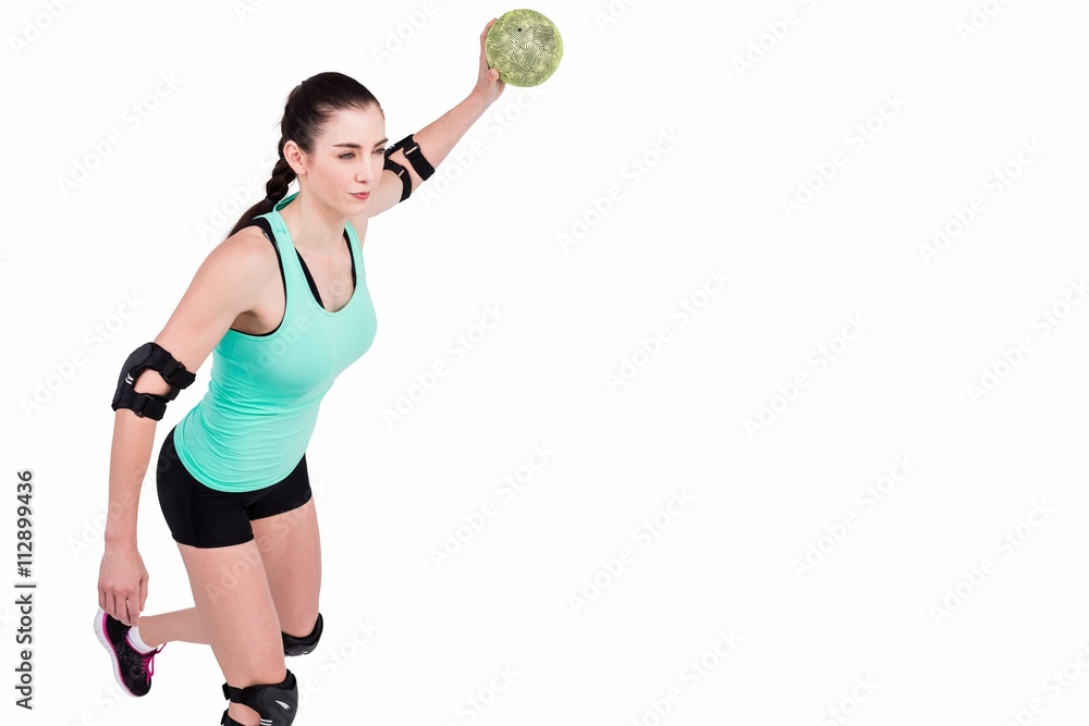 Female athlete with elbow pad throwing handball