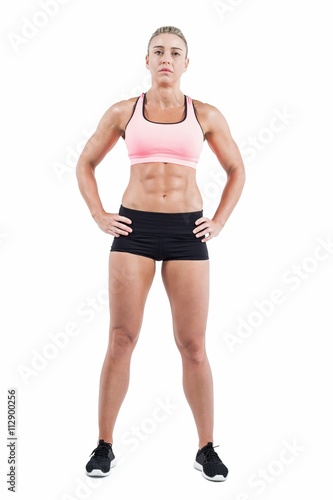 Female athlete posing with hands on hip