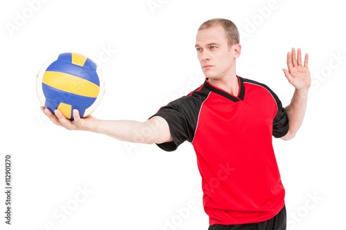 Sportsman getting ready to serve while playing volley ball