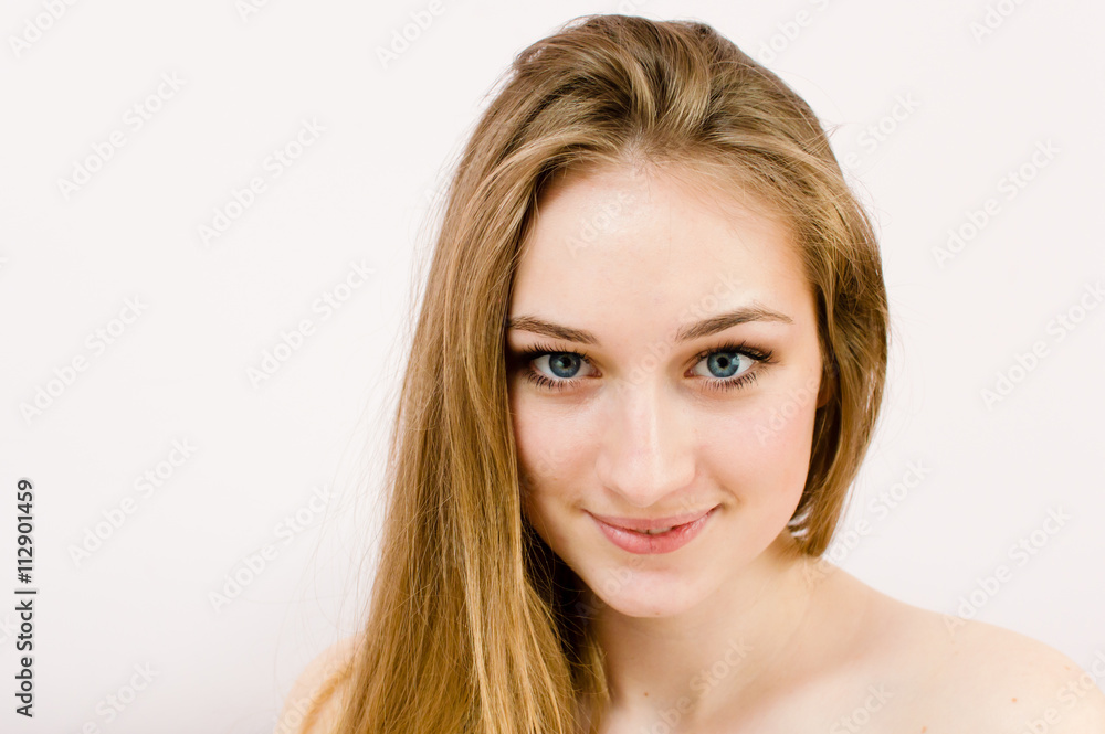 close up portrait of blond attractive topless girl with blue eyes and bare shoulders happy smiling sensually looking at camera on light copy space background close up portrait of blond attractive topless girl with blue eyes and bare shoulders happy smiling sensually looking at camera on light copy space background