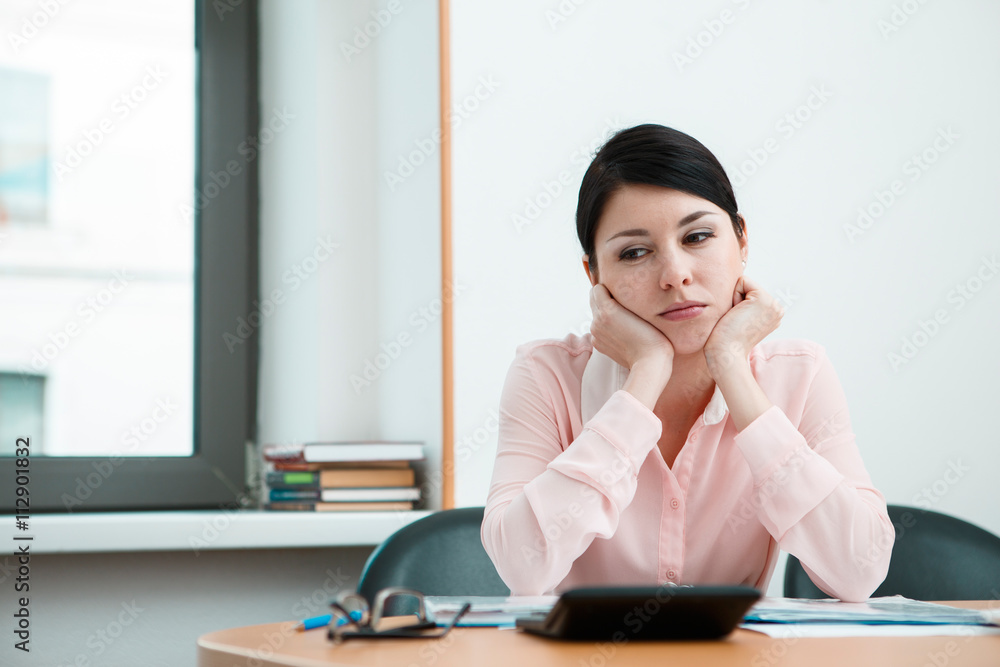 Beautiful woman dreaming at working place Beautiful woman dreaming at working place