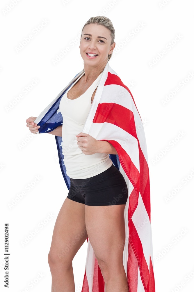 Female athlete with american flag on her shoulders Female athlete with american flag on her shoulders