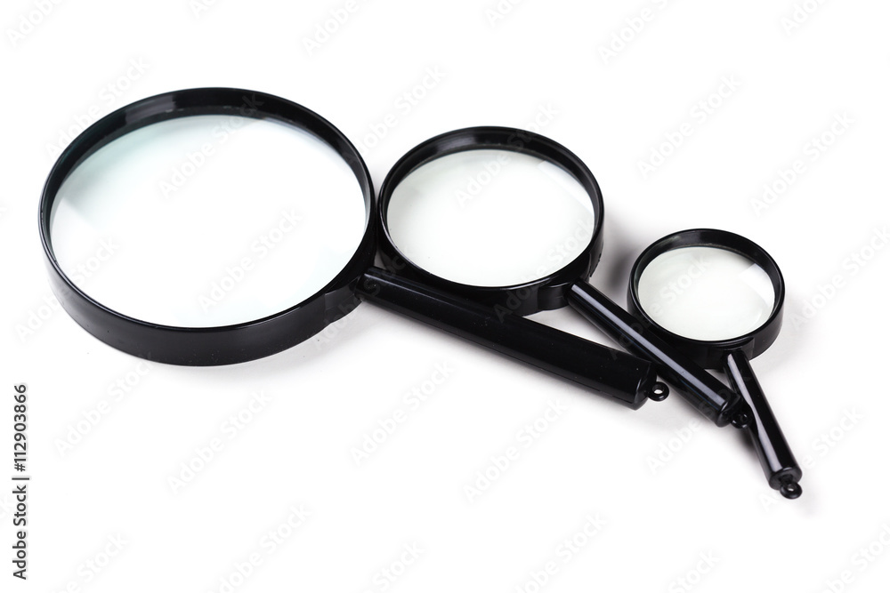 Three magnifiers over white Three magnifiers over white