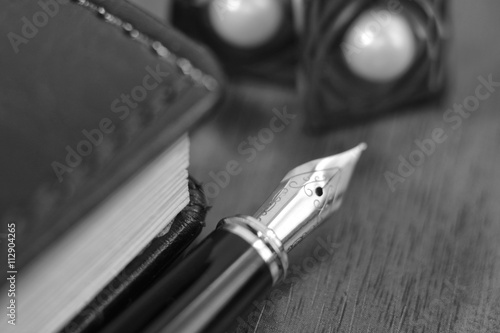 Wallpaper Mural Business accessories on desktop: notebook, diary, fountain pen, cufflinks. Macro with blur and soft focus Torontodigital.ca