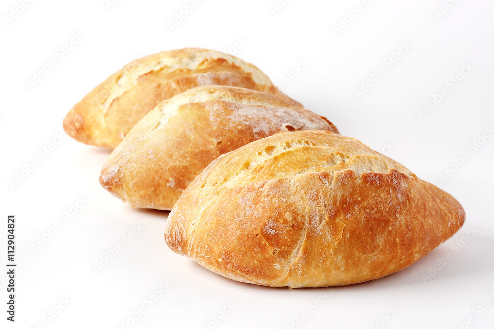 Three French loaf on a white background (not isolate).