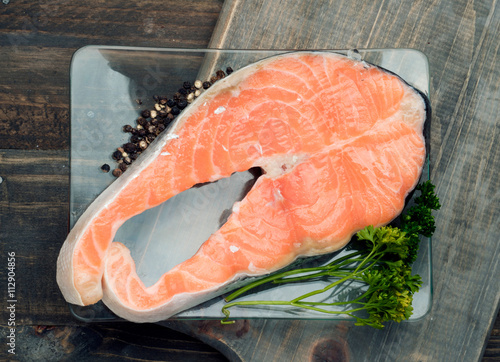 raw salmon steak in pan