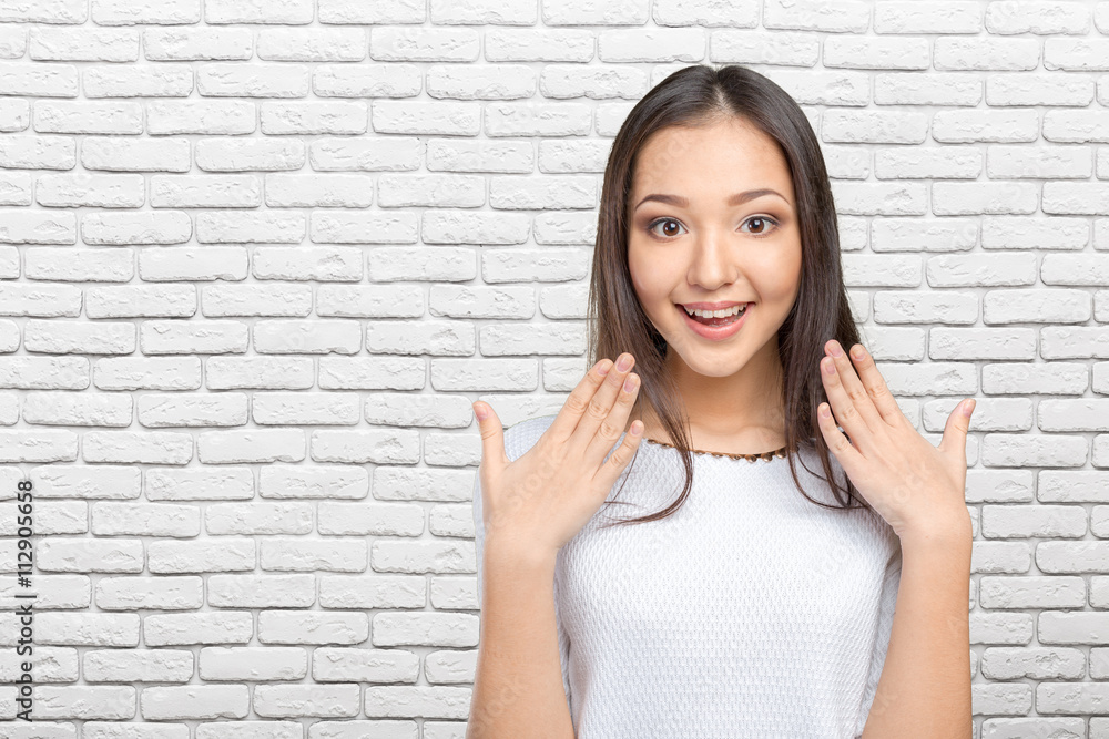 Surprised businesswoman with hands up amazed or shocked by unexpected news