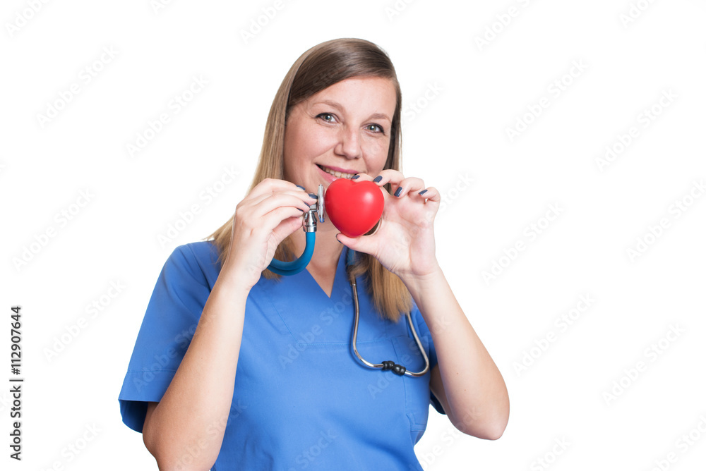 Woman doctor holding a red heart Woman doctor holding a red heart