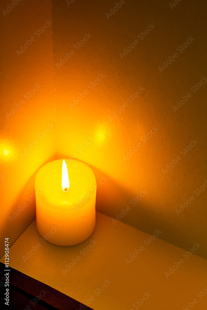 closeup to burning candles in darkness closeup to burning candles in darkness