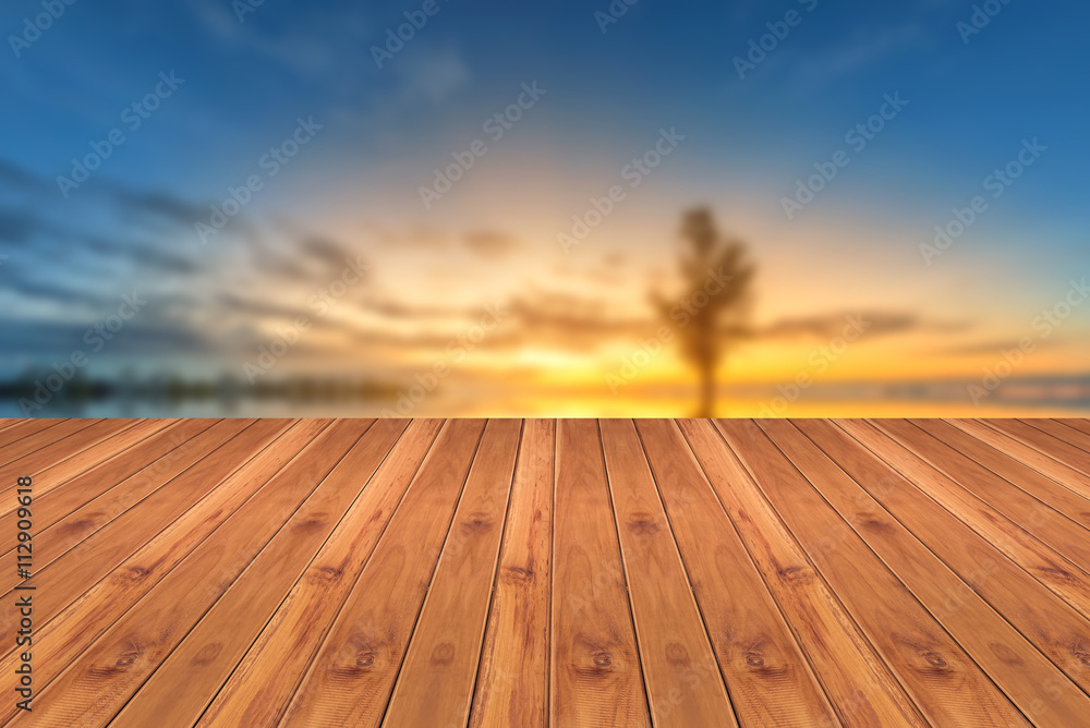 Wood top on blurred background sunset
