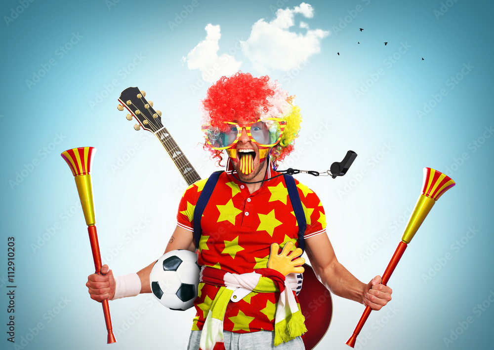 Spain football fan in a red wig and horns - obrazy, fototapety, plakaty 