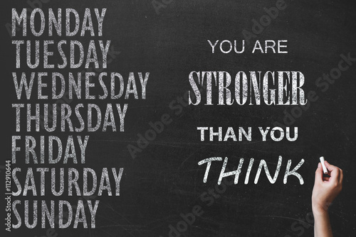 written message 7 day of week on chalk board background and sport motivation text