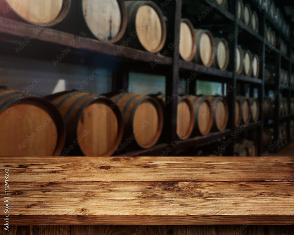 Rustic wooden table in a wine cellar Rustic wooden table in a wine cellar