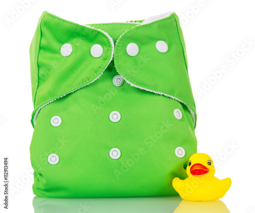 Modern cloth diapers and rubber duck isolated on white.