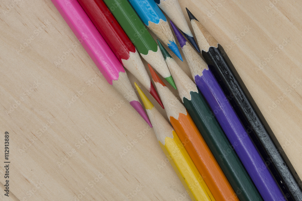 Obraz premium pencils color on wood table.