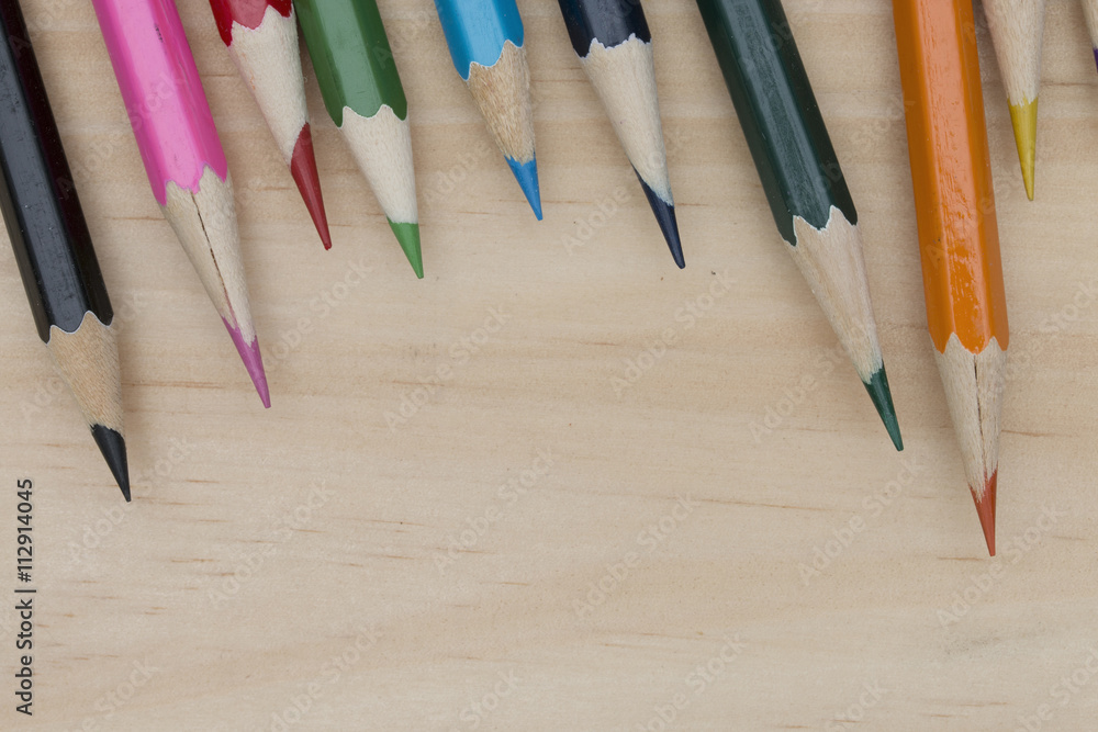 Obraz premium pencils color on wood table.