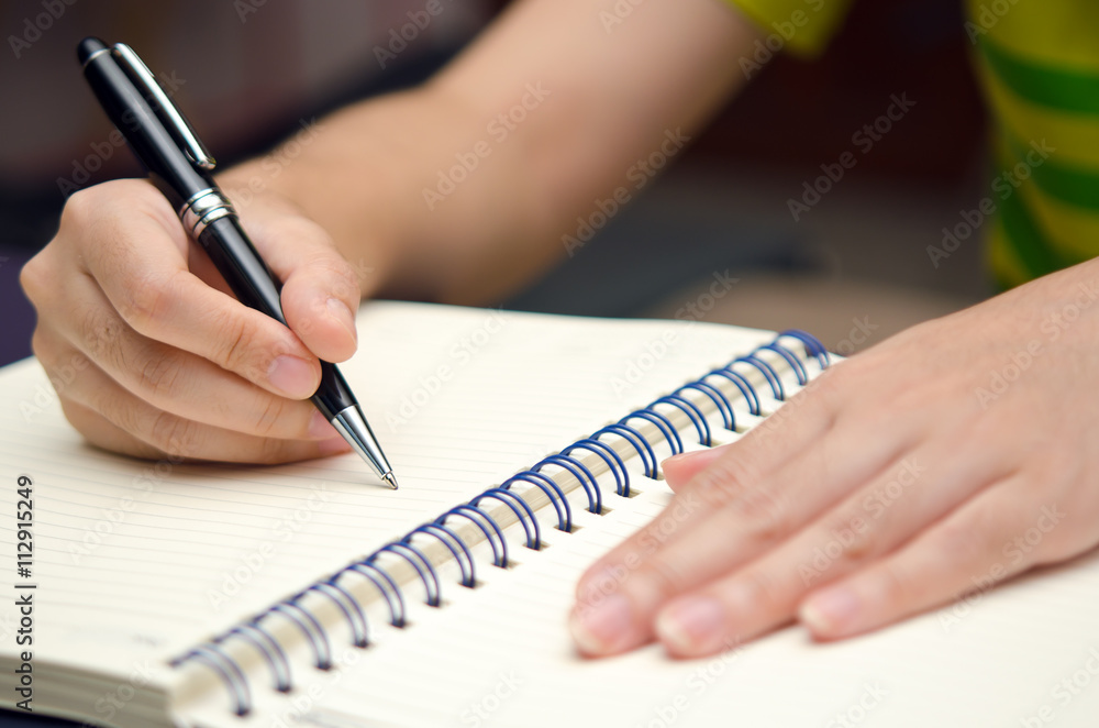 Write activity with a pen and a book Write activity with a pen and a book