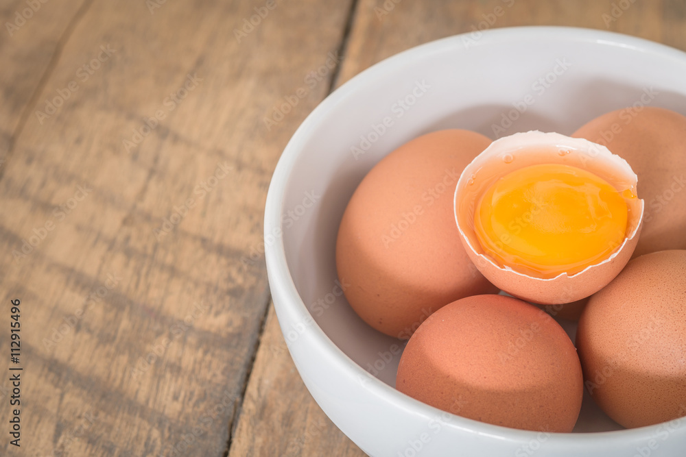 Fresh farm eggs. A egg yolk in cracked egg shell. Fresh farm eggs. A egg yolk in cracked egg shell.