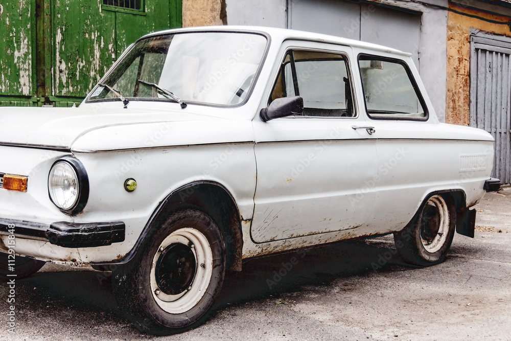 old car on the background wall of a building