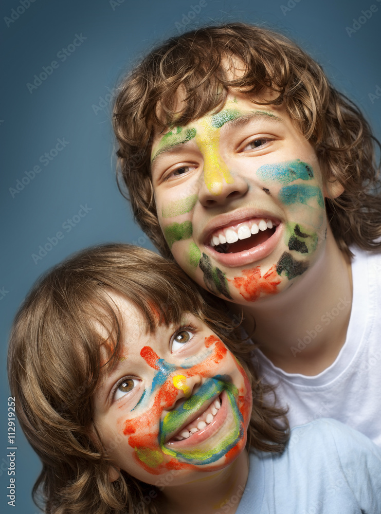 two cheerful brothers with painted faces