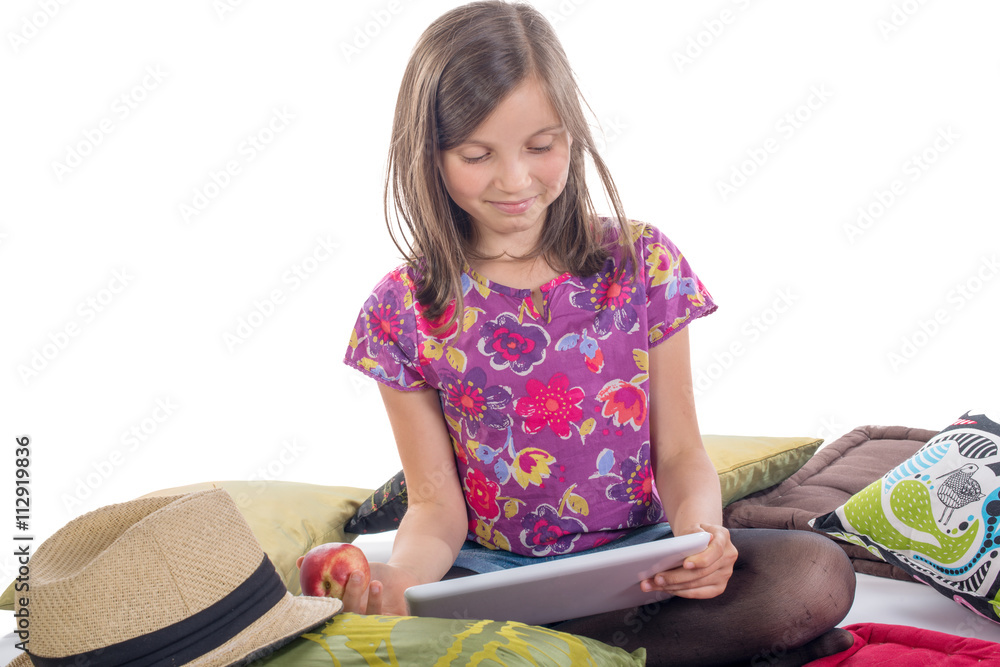 schoolgirl with a digital tablet and apple schoolgirl with a digital tablet and apple