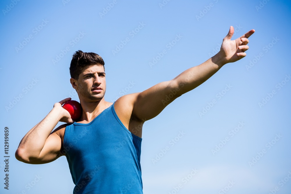 Naklejka premium Athlete about to throw shot put ball