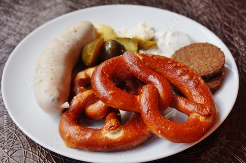 A German breakfast with pretzel and wurst sausage
