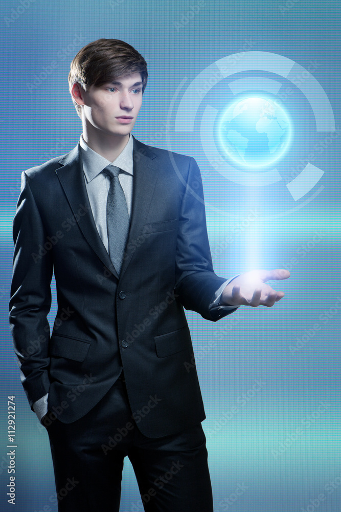 Businessman holding hologram of the earth Businessman holding hologram of the earth
