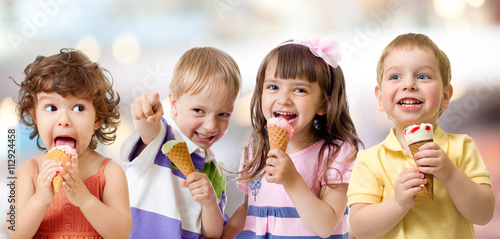 children or kids group eating ice cream