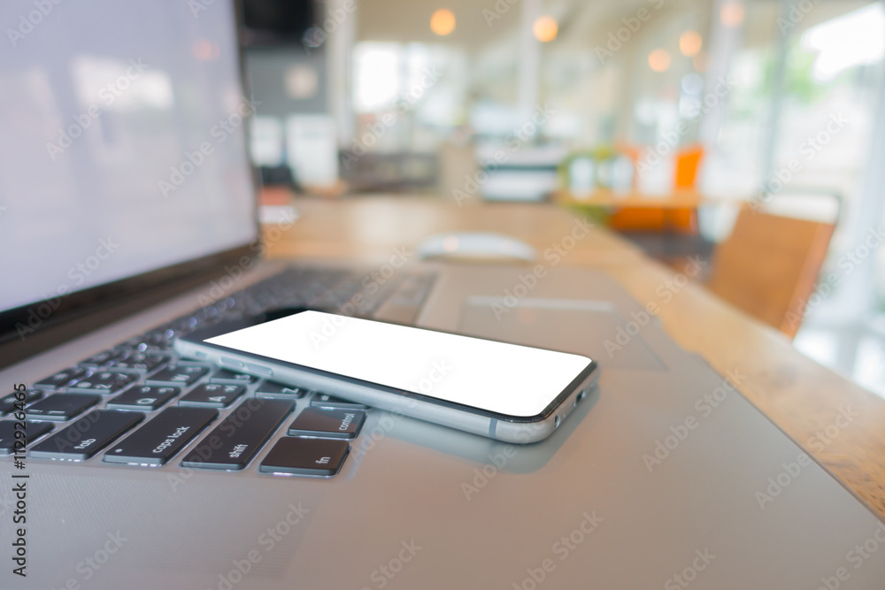 laptop with smart phone on table . laptop with smart phone on table .