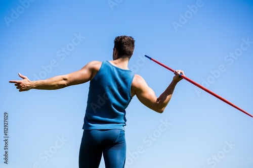 Rear view of an athlete about to throw a javelin