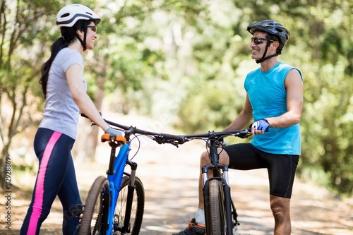 Couple posing with their bikes 