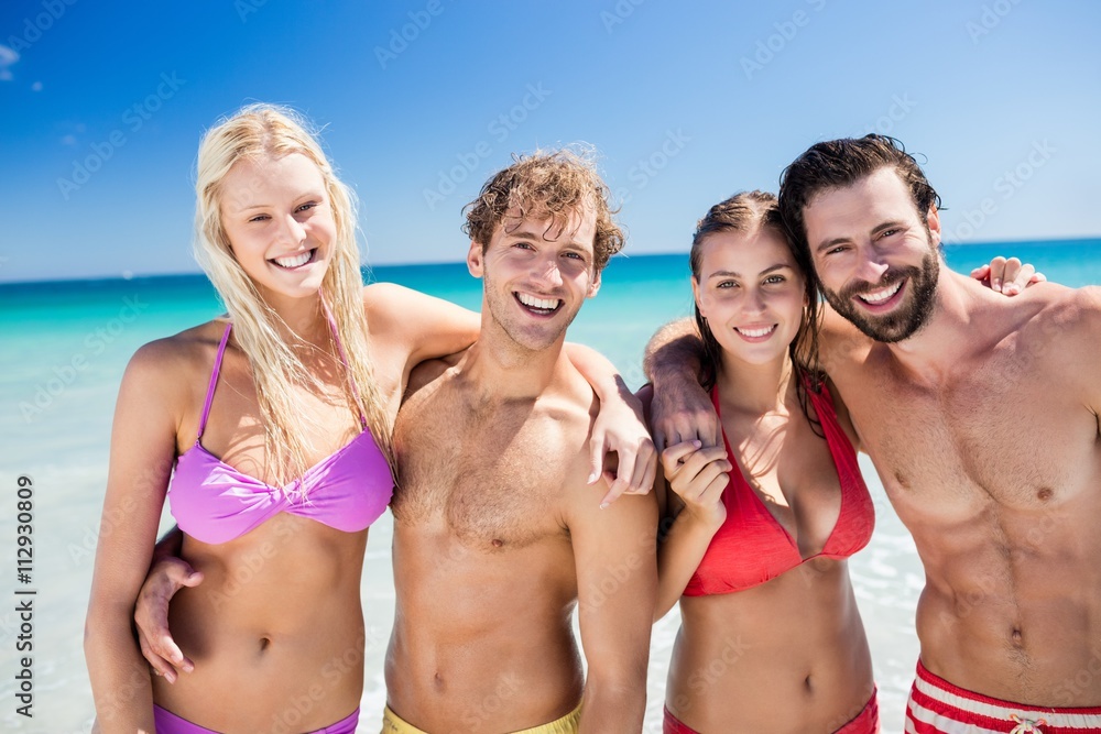 Portrait of friends posing at the beach 