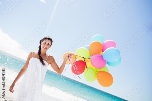  Beautiful woman holding balloon