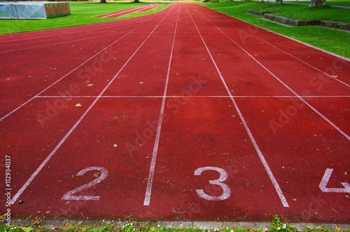 Red treadmill at a sports field