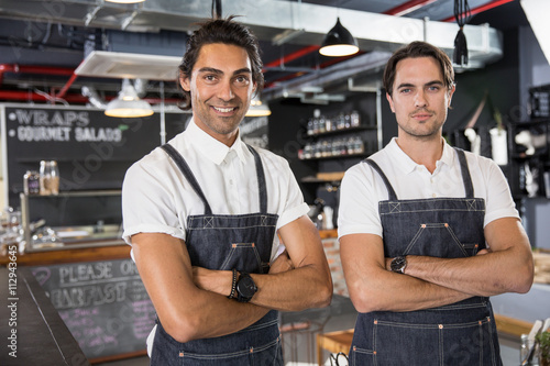 Portrait of happy restaurateurs photo