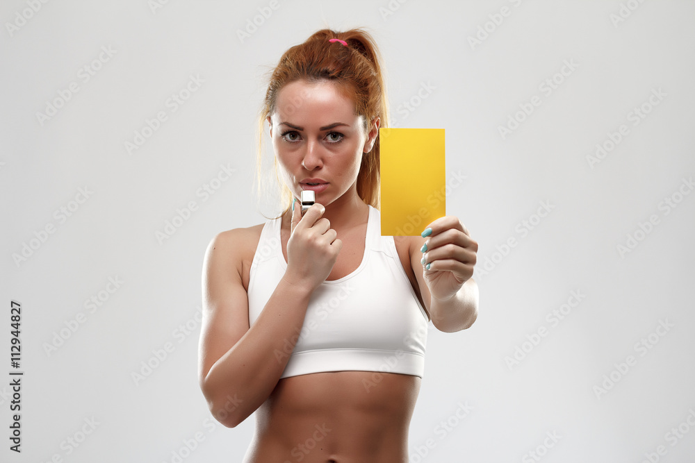 Football supporter with yellow card on white background Football supporter with yellow card on white background
