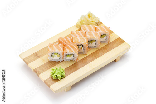 Sushi roll on a gete ( bamboo plate ) isolated on white background photo