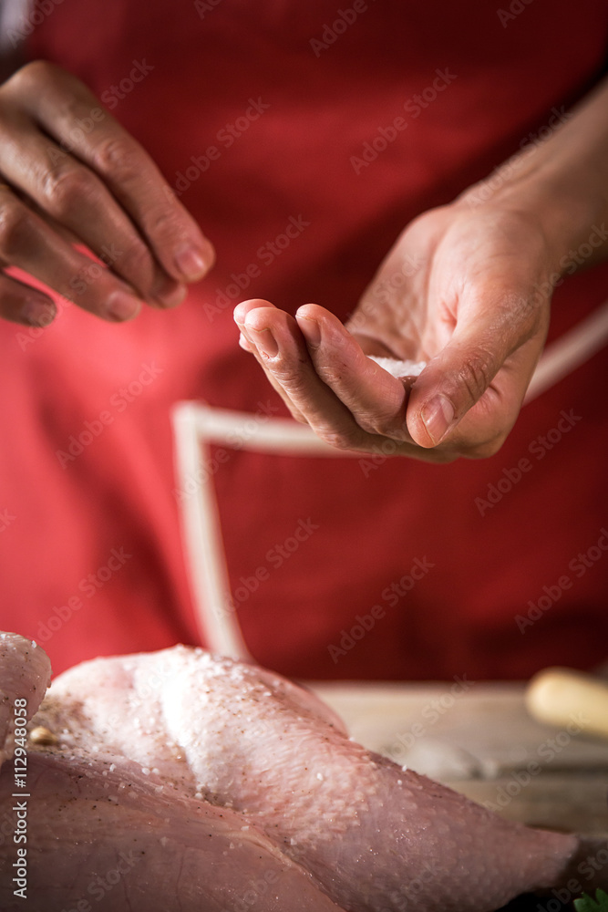 Unrecognizable woman cooking chicken Unrecognizable woman cooking chicken