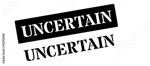 Uncertain black rubber stamp on white