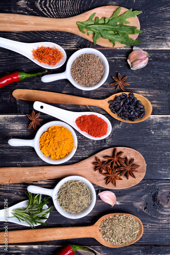 Powder spices & herbs on spoons © olgasun