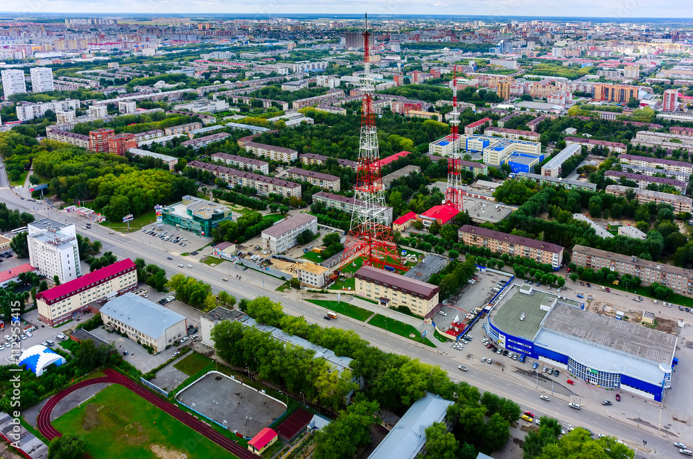 Tyumen, Russia - August 9, 2015: Bird's eye view on TV tower, Prosecutor's office of the Central joint-stock company, shopping centers and residential districts