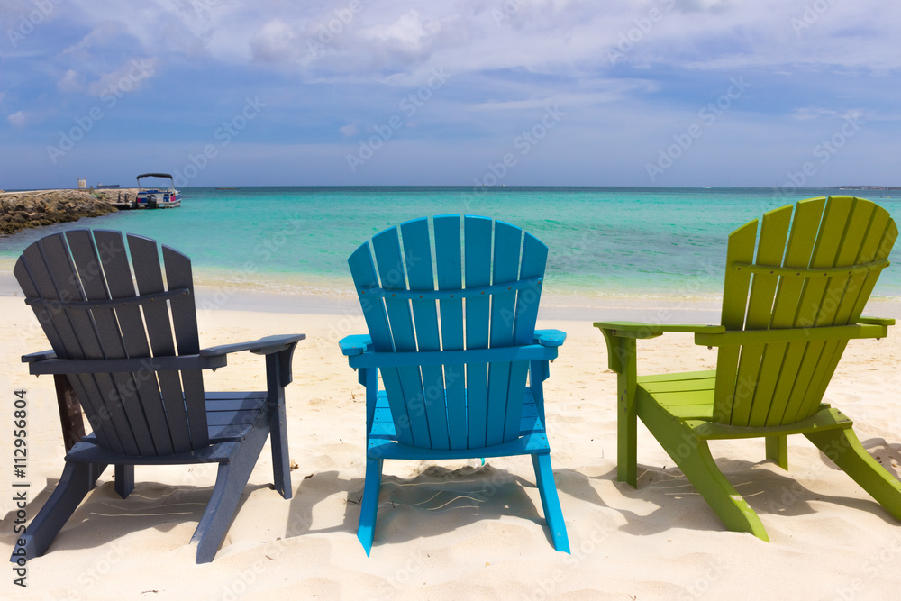 Colorful beach chairs on Caribbean coast